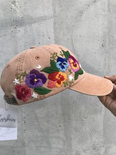 HAND EMBROIDERED WOMEN HAT WITH FLORAL DESIGN Color: terra-cota baseball cap; Design: hand embroidered pansies with wildflowers; Cap size (head circumference): 55 - 67 cm; Fabric: 100% cotton Twill, garment-washed. The quality of the embroidery and baseball hat is superior, I guarantee! ;) I really enjoyed making this, and I hope my customer will enjoy showing it off. 🌿PLEASE NOTE I NEED 2 WEEKS TO EMBROIDER THIS HAT FOR YOU🌿 CHECK OUR OTHER ACCESSORIES 🌸 More Baseball hats: https://www.etsy. Brown Summer Hats With Embroidered Logo, Brown Embroidered Baseball Cap With Curved Brim, Brown Embroidered Curved Brim Baseball Cap, Brown Hat With Embroidered Logo For Summer, Brown Hats With Embroidered Logo For Summer, Brown Embroidered Baseball Cap, Multicolor Cap With Embroidered Logo, Multicolor Embroidered Logo Cap, Embroidered Brown Cap