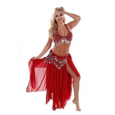 a woman in a red belly dance outfit posing for the camera with her hands on her hips