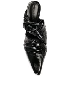 Find BOTTEGA VENETA Bunnie Mule on Editorialist. Bottega Veneta Bunnie Mule in Black Leather upper with rubber and leather sole. Made in Italy. Slip-on styling. Leather footbed and lining. Ruched styling. Pointed toe with spool heel. Approx 100mm/ 4 inch heel. BOTT-WZ507. 763775-V3H90-1000. About the designer: Bottega Veneta – inspiring individuality with innovative craftmanship since 1966. Creativity lies at the heart of all that we do. Born in Vicenza the house is rooted in Italian culture yet maintains a truly global outlook. An inclusive brand with exclusive products Bottega Veneta is as much of a feeling as it is an aesthetic. Bottega Veneta Shoes, Spool Heel, Italian Culture, 4 Inch Heels, Mule, Bottega Veneta, 4 Inch, Leather Upper, Black Leather