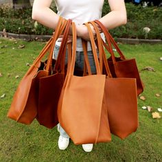 Extra large tote bags for woman. This casual shoulder tote with two internal pockets over can be carried in hands. Made of thick leather with sewn handles and holds its shape well. A very compact and convenient bag and capacious tote bag. It can be used everyday for studying at a college or university or going to work with it. A bag will fit quite a lot of different things, such as a phone, keys, documents, glasses, a small lunchbox or tablet. It can be a good gift for your loved ones and friend Vegetable Tanned Leather Shopping Bag With Leather Handles, Vegetable Tanned Leather Bags With Leather Handles For Shopping, Shopping Satchel With Leather Handles And Vegetable Tanned Leather, Travel Tote Bag With Vegetable-tanned Leather, Vegetable Tanned Leather Satchel With Leather Handles For Shopping, Shopping Bags With Double Handle In Vegetable Tanned Leather, Vegetable-tanned Leather Shoulder Bag For Shopping, Leather Tote Shoulder Bag For Shopping, Vegetable-tanned Leather Tote Shoulder Bag