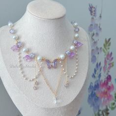 Step into a world of enchantment with our handmade Violet Fairy Blossom Choker Necklace, a magical accessory that captures the essence of fairy and princesscore aesthetics. Adorned with a stunning violet crystal butterfly centerpiece, surrounded by delicate glass beads and flowers, this necklace is designed to add a touch of whimsical charm to your look. 🌸 Key Features: Violet Crystal Butterfly: The centerpiece of this necklace is a captivating violet crystal butterfly, symbolizing transformati Princess Necklace Aesthetic, Fairy Jewelry Bracelet, Purple Butterfly Necklace, Fairy Necklace Diy, Butterfly Bead Pattern, Purple Necklace Aesthetic, Cute Bracelet Ideas Bead, Purple Fashion Aesthetic, Flower Necklace Aesthetic