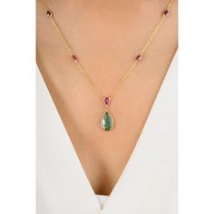 This stunning necklace features a modern teardrop-shaped emerald and a pear-cut ruby, both elegantly suspended from a delicate chain. The vibrant green and deep red gemstones create a striking contrast, making it a perfect statement piece for any occasion. The sleek design exudes contemporary sophistication and timeless beauty. Emerald enhances the intellectual capacity. Designed with a pear cut emerald set in bezel settings in a chain of the necklace to make you stand out of the crowd. This is a perfect May Birthstone Jewelry Grandma Gift, Bridal Shower Gift, Mom Gift, Gift For Sister, Mother Daughter Gift, Bride To Be Gift, Bridesmaid Gift, Anniversary Gift, Friendsgiving Gift, Engagement Gift, Wedding Gift, Mother's Day Gift or any Holiday Gift for Mother, Sister, Daughter, Grandma, Fia Teardrop Ruby Necklace In Yellow Gold, Classic Pear-shaped Emerald Necklace, Formal Pear-shaped Ruby Necklace, Red Pear-shaped Gemstone Necklace, Pear-shaped Ruby Gemstone Necklace, Mother Daughter Gifts, Red Gemstones, Pear Cut, Stunning Necklace