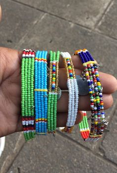 This is a unique design of the African Masai anklets originally from Kenya. it has some added decoration which gives them a beautiful look while worn. It can be worn on different occasions. and the multi-colors on it makes it fit well with all attires. Customization is done according to the clients preferred colors and sizes. shipping is through the DHL Express. Thank you. African Anklet Beads, Traditional Anklets With Round Beads, Green Beads For Festivals, Adjustable Multicolor Traditional Anklet, Traditional Adjustable Multicolor Anklets, Traditional Green Beaded Bracelets For Festival, Traditional Green Beaded Bracelets, African Anklets, Masai Jewelry