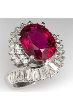 an oval shaped ruby and diamond ring