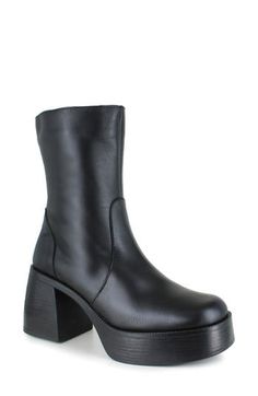 A stacked platform and sculptural block heel add statement-making height to a leather bootie outfitted with a side zipper for easy entry. 3" heel; 1 3/4" platform 6" shaft Side zip closure Water resistant Leather upper and lining/synthetic sole Made in Italy Chunky High Heel Leather Platform Boots, Edgy Platform Heeled Boots With Block Heel, Edgy Boots With Chunky Platform And Block Heel, High Cut Faux Leather Heeled Boots For Fall, Faux Leather Wide Calf Platform Boots, Fall High Cut Faux Leather Heeled Boots, Fall High-cut Faux Leather Heeled Boots, Edgy Wide Calf Platform Boots In Faux Leather, Wide Calf Faux Leather Platform Boots With Block Heel