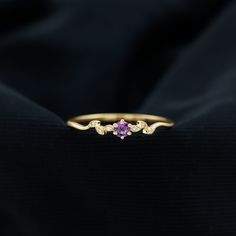 Product Details Embrace a promise of eternal love with this enchanting Promise Ring. The captivating centerpiece of this sparkling ring is a Round Shape Amethyst gemstone, delicately set in a prong setting. The Leaf Branch inspired band is adorned with shimmering Diamond gems, adding a touch of elegance and sophistication. This ring exudes a sense of class and grace, making it a perfect symbol of your commitment. Product Information SKU SHP-RINGS0821209718 Width 2.9 mm Height 3.7 mm Weight 1.52 gm (Approximate) AMETHYST INFORMATION No.of Stones 1 Pieces Total Weight 0.45 Carat (Approximate) Dimension(approx) Round-5X5 mm-1 Pcs Color Voilet Cut Brilliant Shape Round Setting Type Prong-Setting Quality Grade AAA DIAMOND INFORMATION No.of Stones 6 Pieces Total Weight 0.02 Carat (Approximate) D Sparkling Rings, The Leaf, 18k Yellow Gold Ring, February Birth Stone, Eternal Love, Amethyst Gemstone, Promise Ring, Birthstone Jewelry, Yellow Gold Rings