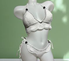 Turn heads and radiate confidence in this exclusive crochet bikini set. Handcrafted for a look as unique as you are! This bikini is crafted from a luxurious 50% cotton and 50% acrylic blend, offering both the natural breathability of cotton & the soft, comfortable feel of acrylic. Perfect for soaking up the sun in comfort!  ---------CARE-------- For the gentlest care, hand wash it with cool water only and lay it flat to dry. Alternatively, you can machine wash on a gentle cycle with cool water, White Crochet Swimwear For Pool, Handmade White Swimwear For Vacation, Handmade White Swimwear For Poolside, Handmade White Summer Swimwear, Handmade White Triangle Top Swimwear, White Handmade Summer Swimwear, Handmade White Swimwear For Summer, Handmade White Swimwear For Beachwear, Handmade White Swimwear For Beach Season