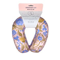 the pink and blue flower print hair scrunch is packaged in a package on a white background