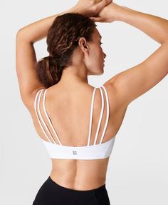 Our super-soft, ultra-comfy new bra for low-impact workouts and all-day wear. Fabric is soft, stretchy and sweat-wicking. Lightweight, cushioned feel with moulded cups that offer gentle support. Triple strap detail. Model wears size S and is 178cm/5'10" tall. Style Code: SB9274Colour: White White Yoga Sports Bra With Built-in Padding, Athleisure Training Bra With Adjustable Straps, Sporty Workout Bra With Adjustable Straps, White Sports Bra For Athleisure, Sports Bra With Adjustable Straps And Compressive Fit, Compressive Sports Bra With Adjustable Straps For Workout, White Compressive Bra With Light Support, Medium Support Gym Bra With Adjustable Straps, Training Bra With Adjustable Straps And Stretch Fit