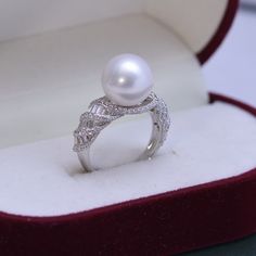 This freshwater pearl ring is crafted with 10-11mm white pearls for a classic look. The perfect round shape and subtle flaw make each pearl unique and special. The S925 silver ring is adjustable, allowing for a comfortable fit for any woman. Description:Size: Open closure to fit all sizes.Materials: 925 Sterling Sliver plated with 18k GoldGemstone: Pearl、Cubic ZirconiaHypoallergenic Product Information pearl type : Freshwater Pearl Shape :Near-round Size :10-11mm color : White Luster : Very High Sentimental Gifts For Mom, Gold Pearl Ring, Pearl Accessories, Freshwater Pearl Ring, Pearl Types, Premium Gift, Sentimental Gifts, Perfect Gift For Her, Natural Pearls