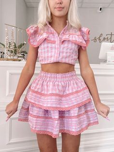 Dream Chaser Pink Gingham Ruffle Skirt | Sassy Shortcake | sassyshortcake.com Cute Lace Trim Bottoms For Spring, Spring Plaid Ruffled Skirt Bottoms, Plaid Tiered Skirt With Ruffles, Cute Tiered Skirt Shorts With Ruffles, Summer Tiered Bottoms With Lace Trim, Casual Gingham Skirt With Ruffles, Tiered Bottoms With Lace Trim For Summer, Casual Tiered Bottoms With Lace Trim, Tiered Lace Trim Bottoms For Summer