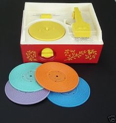 the toy has four different colored discs in it's box and is next to each other