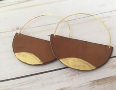 A lot of love and attention to detail went into these brown circle leather statement earrings. Leather pieces were cut into the half moon shape. Each moon was then given a tiny touch of gold paint on the bottom. The edges of the crescents were then burned to give them a darkened, rustic appearance. The ear wires were cut to length and formed into the curved shape. The ear wires are made from jeweler's bronze. These earrings measure approximately 2 5/16 x 3 inches. Thanks for checking out my earr Modern Small Hoop Brown Earrings, Modern Brown Small Hoop Earrings, Handmade Brown Hoop Earrings For Everyday Wear, Everyday Handmade Brown Hoop Earrings, Brown Hoop Earrings Gift, Modern Brown Leather Earrings, Monarch Jewelry, Large Gold Earrings, Clay Inspo