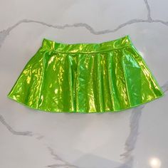 Perfect For Sumner Rave Season With This Pretty Shinny Green Mini Skirt One Size Stretchy Fabric Very Very Flattering Neon Green Mini Skirt, Neon Mini Skirts, Green Skirted Skort With Lined Skirt, Fitted Green Mini Skort, Fitted Green Tennis Skirt With Lining, Green Fitted Skort, Trendy Fitted Green Skort, Green Stretch Mini Skort, Casual Green Skort For Party