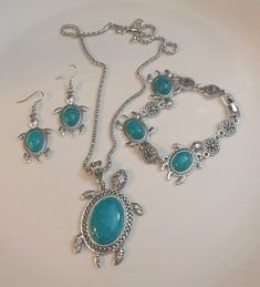 Turtle tourquoise boho vintage jewelry set, Necklace, pendant, chain, earrings and bracelet, birthday and anniversary gift The main material is alloy. Silver plated Costume Jewelry Alloy Jewelry For Gifts, Turquoise Costume Jewelry Gift, Turquoise Bohemian Jewelry As Gift, Bohemian Turquoise Jewelry As Gift, Elegant Adjustable Turquoise Jewelry Set, Handmade Alloy Jewelry For Gifts, Handmade Alloy Jewelry As Gift, Green Alloy Jewelry For Gift, Adjustable Turquoise Jewelry With Lobster Clasp