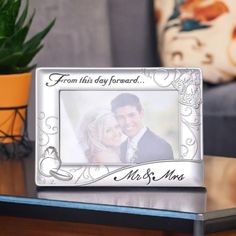 a personalized metal frame with an image of a bride and groom