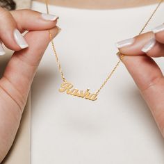 Your name is your identity - make it unforgettable with our iconic custom name necklace, now made in 14 Karat Solid Gold. Available in Arabic or any other language in the world, spell out any name and we'll make it yours. It's the perfect beautiful gift (even if it's to yourself). Whether for a birthday or anniversary or simply just because, our solid gold name necklace is a memorable and meaningful piece that will always stand the test of time, in style and quality. *Please keep in mind that our custom pieces are hand-made, ensuring that each piece is one-of-a-kind, with slight size variations that add to its unique charm. Due to the fact that this item is made one of one we are unable to offer returns or exchanges. How to Order *Please note that this piece is handmade and takes 20 days t Adjustable Gold Name Necklace, Gold Name Necklace With Adjustable Pendant, Custom Name 14k Gold Name Necklace, Custom Name Yellow Gold Pendant Necklace, 14k Gold Custom Name Pendant Jewelry, Gold Name Necklace, Solid Gold Chains, Custom Name Necklace, Gold Shimmer