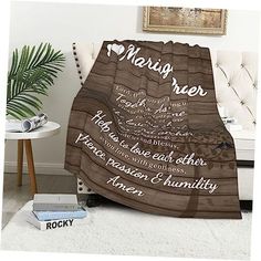 a personalized blanket with the names of people and places on it in brown tones