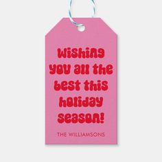 a pink gift tag with the words, wishing you all the best this holiday season