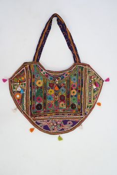 This gorgeous Indian Jaipuri Morral is perfect to style with any outfit! It is completely hand-embroidered and made on a waist loom, These beautiful bags are handmade by Indian artisans in Jaipur, Rajasthan. Material - 100% Cotton Fabric, The bag closes with a High-Quality zipper. Our bags are strictly produced by our skilled team with the natural traditional way of craftsmanship. A Perfect Shoulder Bag / Hobo Bag / Tote Bag / Hand Bag to give to an elegant look. This is the perfect gift for all Multicolor Handwork Rectangular Potli Bag, Multicolor Embroidered Potli Bag For Festivals, Embroidered Multicolor Potli Bag For Festivals, Traditional Bags With Multicolor Embroidery And Handwork, Traditional Handmade Multicolor Hobo Bag, Multicolor Potli Bag For Daily Use, Traditional Bag With Multicolor Embroidery, Traditional Handmade Bags For Navratri, Traditional Multicolor Embroidered Bag