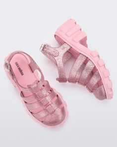 A runaway best-seller for adults, Megan's tread-tastic style is now available for the little ones. Megan has the same bold personality as the larger size with plenty of chunk. The sole is light and comfy to help keep your mini fashionista on the go all day long. Perfect to complement any look, Megan is all style, no fuss. Cheap Pink Jelly Sandals For Party, Cheap Pink Trendy Jelly Sandals, Playful Synthetic Sneakers For Summer, Casual Jelly Sandals With Rubber Sole And Round Toe, Cute Synthetic Sneakers For Summer, Cute Synthetic Summer Sneakers, Cute Summer Synthetic Sneakers, Trendy Open Toe Sneakers For Spring, Casual Party Sandals With Translucent Outsole