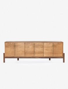 the sideboard is made out of wood and has four drawers on one end, two doors