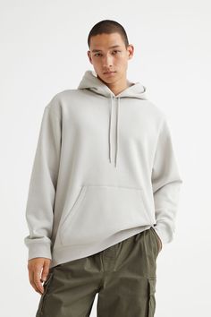 Relaxed-fit sweatshirt hoodie in cotton-blend fabric with soft  brushed inside. Jersey-lined drawstring hood  kangaroo pocket  and long sleeves. Wide ribbing at cuffs and hem. Gray Hoodies, H&m Shirts, Workout Sweatshirt, Oversized Silhouette, Workout Hoodie, Sweatshirt Hoodie, Fashion Company, Black Hoodie, Kangaroo Pocket