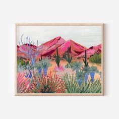 a painting of desert scene with cactus trees and mountains in the background, on a wooden frame