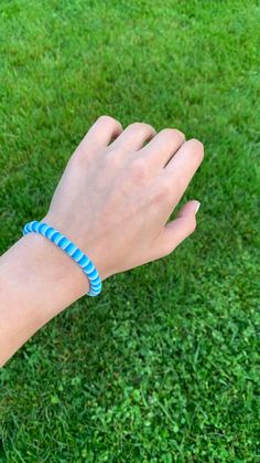 A preppy blue themed bracelet made with stretchy string for easy on and off. Blue Preppy Bracelets, Trendy Blue Bangle Bracelets, Trendy Blue Bangle Bracelet, Trendy Blue Beaded Bangle Bracelet, Casual Turquoise Stretch Bracelet For Friendship, Blue Beaded Bangle Bracelets For Everyday, Everyday Blue Beaded Bangle Bracelets, Everyday Blue Beaded Bangle Bracelet, Adjustable Blue Friendship Bangle Bracelets