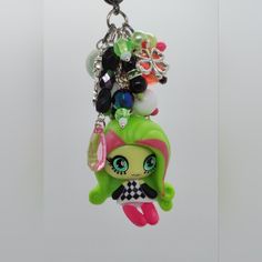 a keychain with many different items hanging from it's back end on a white background