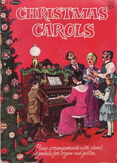 an old fashioned christmas carols book with children playing the piano and singing in front of it