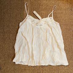 Beautiful Cream/White Lace Tank Top From Elodie. Perfect Dressed Up Or Down. Staple Item. Soft Fabric With Elegant Lace Trim. Make An Offer If Interested! Thanks For Shopping! Summer Tops With Lace Trim For Daywear, Summer Lace Trim Tops For Daywear, Feminine White Camisole With Lace Top, Feminine White Lace Top Camisole, Feminine White Lace Camisole, Spring Cami Tops With Lace Trim, Casual White Crochet Lace Top, White Feminine Lace Cami Top, Off White V-neck Top With Lace Trim