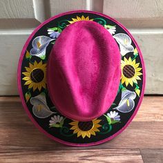 Stand out with this beautiful handcrafted Mexican Suede Hat with beautiful detailed floral embroidered canvas brim. Perfect accessory to add that with that daily outfit. MADE IN MEXICO By: Mexican Artisans For: Women Size: Medium 23' Color: magenta | multi Details: Top Suede Embroidered canvas brim Inner elastic band Contact us for more details PLEASE READ BEFORE PURCHASE: The picture is an ACCURATE REPRESENTATION.Colors in the pictures may vary a little by effects of light. Each product is hand Traditional Wide Brim Fitted Hat, Traditional Fitted Wide Brim Hat, Fitted Brimmed Sun Hat For Festivals, Embroidered Fitted Cap, Spring Festival Costume Hat With Short Brim, Traditional Fitted Summer Hats, Festival Embroidered Fedora Hat, Embroidered Fedora Hat For Festivals, Custom Brimmed Felt Hat For Spring