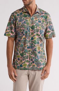 An artistic tropical trees print brings resort-ready appeal to a short-sleeve button-up shirt constructed from soft, breathable cotton. 29" length Front button closure Point collar Short sleeves Chest patch pocket 100% cotton Machine wash, tumble dry Made in the USA of imported fabric Spring Short Sleeve Camp Shirt With All Over Print, Spring Cotton Camp Shirt With All Over Print, Pink Palm Tree Print Short Sleeve Top, Short Sleeve Hawaiian Shirt With All-over Print For Spring, Cotton Camp Shirt With All Over Print, Spring Vacation Camp Shirt With All Over Print, Spring Vacation Camp Shirt With All-over Print, Spring Vacation All-over Print Camp Shirt, Pink Cotton Top With Palm Tree Print