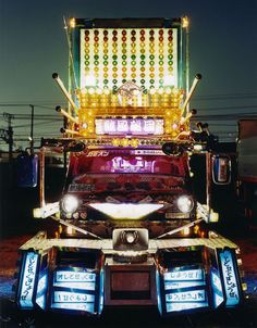 the truck is decorated with colorful lights and decorations