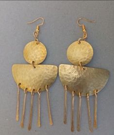 The earrings are  made with a lot of love and care from brass.  The are  beautifully designed for you, sister, mother, relative or a friend. The are light in weight and comfortable to wear. **This listing is for one pair of earrings.** Buy multiple items pay shipping for one the rest ships free. Custom orders are welcome. For more earrings, follow the link. https://www.etsy.com/listing/922901690/brass-wholesale-earrings-african?ref=shop_home_active_10 **Happy shopping** Dhl shipping express Thank you. Cheap Brass Jewelry With Matching Earrings, Luxury Brass Earrings For Ceremonial Occasions, Affordable Symbolic Brass Earrings, Cheap Traditional Brass Jewelry, Cheap Unique Brass Earrings, Unique Cheap Brass Earrings, Cheap Brass Jewelry For Festivals, Cheap Traditional Brass Earrings, Bronze Brass Drop Chandelier Earrings