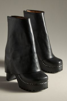 Leather upper, insole Rubber sole Pull-on styling Imported | Bootcut Foldover Boots by Swedish Hasbeens in Black, Women's, Size: 38, Leather/Rubber at Anthropologie Leather Wedge Boots With Sculpted Heel And Round Toe, Leather High Heel Wedge Boots With Sculpted Heel, Designer Leather Boots With Stacked Heel, Designer Leather Platform Boots With Pointed Toe, Designer Ankle Platform Boots With Leather Sole, Designer Boots With Pointed Toe And Rubber Heel Cap, Black Leather Wedge Boots With Sculpted Heel, Leather Platform Boots With Square Toe, Leather High Heel Wedge Boots With Lug Sole