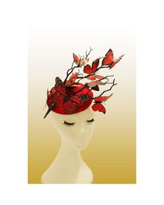 Hat Title : Lolaka (in red) A showstopper hat made with red round base, which is adorned with dark twisting branches and fluttering butterflies in different shades of red. The branches move upward to the side, carrying the eye with it and giving the impression of height and drama. The butterflies are in different shades of red which add depth to the composition.  Perfect for race days, weddings and other special events.  Adheres to your head via a millinery elastic and a comb. Note:If you wish t Red Top Hat With Curved Brim For Spring, Red Curved Brim Top Hat For Spring, Whimsical Red Headband Style Headpiece, Red Whimsical Headband Style Headpiece, Fitted Red Brimmed Top Hat, Red Short Brim Top Hat For Spring, Red Adjustable Fascinator With Curved Brim, Red Adjustable Fascinator, Red Summer Fascinator With Short Brim