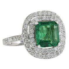 Stamped: 14K White Gold Total Ring Weight: 5.2 Grams Ring Length: N/ARing Width: N/A Gemstone Weight: Total Natural Emerald Weight is 2.62 Carat (Measures: 8.50x8.20 mm) Color: Green Diamond Weight: Total Natural Diamond Weight is 1.00 Carat Quantity: 68 Color: F-G, Clarity: VS2-SI1 Face Measures: 16.10x15.00 mm Sku: [702823W] Formal Gia Certified Emerald Gemstones, Classic Halo Ring With Brilliant Cut For May Birthstone, Classic Green Cluster Diamond Ring, Classic Diamond Halo Ring For May Birthstone, Formal Emerald Gemstones With Prong Setting, Platinum Green Gemstone Rings, Green Gemstone Platinum Ring, Classic Green Platinum Ring, Classic Green Platinum Rings