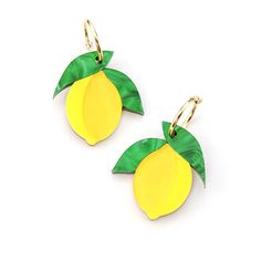 two yellow and green earrings with leaves on them