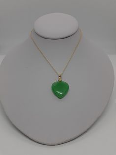 Green Jade Heart Charm pendant / Necklace, Love Jade in Gold Plated with chain. The vibrant green variations of Jade are a symbol of growth and vitality, which makes it a stone that stands for wealth and longevity. And it's not all about the Benjamin's, because when Jade instills prosperity in every aspect of your life, you lead a richer, more fulfilling existence. After all, money can only buy so much happiness. - Stone: Green Jade Heart. - Heart Measures: 22mm x 20mm. - Metal: Silver and Gold Green Heart Pendant Emerald Necklace As Gift, Green Heart Beads Necklace For Gift, Green Heart Necklace For Gift, Green Heart Beads Necklace As Gift, Green Heart Beads Necklace For Gifts, Green Necklaces With Heart Beads For Gifts, Green Emerald Heart Pendant Necklace As Gift, Green Teardrop Pendant Necklace For May Birthstone, Green Heart Necklace For Valentine's Day Gift