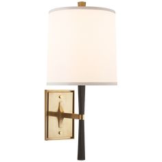 a wall light with a white shade on the side and a gold frame around it