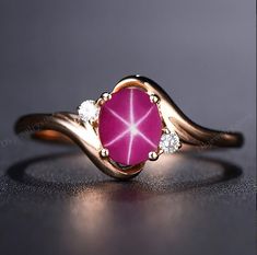 14k Rose Gold Pink Star Sapphire Ring, Lindy Star Sapphire, 925 Sterling Silver, Star Gemstone, Lindy Star Ring, Star Sapphire Jewelry ★ Settings ☆ Metal - 925K Sterling Silver/ 14k Rose Gold ☆ band Color - Rose / White / Yellow ⍟ The ring size shown in the pictures is 7 US. ★ Main Stone ☆ Stone - Lab Created Pink star sapphire ☆ Size - 6×8 mm ☆ Shape - Oval ☆ Color Grade- AAA ☆ Certificate of Authenticity and lifetime warranty by Dkjewelrystore ☆ Side Stone - Round CZ Diamonds ★ Features : ☆ Ha Lindy Star Ring Sapphire, Star Saphires, Star Sapphire Engagement Ring, Star Sapphire Jewelry, Yellow Sapphire Ring Engagement, Star Sapphire Gemstone, Pink Gemstone Ring, Oval Sapphire Engagement Ring, Texture Jewelry