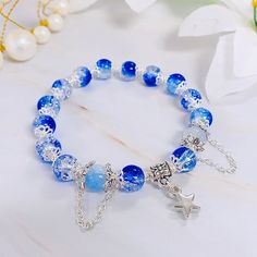 This cute bracelet is casual and suitable for any occasions. It's also a great gift idea for family, friends, or children. Casual Charm Bracelet With 8mm Beads As Gift, Casual Charm Bracelet With Round Beads For Gift, Casual Jewelry Gift With Star Charm, Casual Jewelry With Star Charm For Gift, Casual Jewelry With Star Charm As Gift, Beaded Bracelets With Star Charm For Gifts, Casual Star Charm Jewelry Gift, Casual Silver Star-shaped Bracelets, Casual Silver Star Bracelets