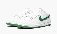 The Women’s Nike Dunk Low “Green Noise” is a women’s version of the vintage basketball shoe is a classic white-and-green color block.  Perhaps showing love to the Boston Celtics with its white-and-green color scheme that mimics the look of the C’s team uniform colors, the “Green Noise” is a clean and casual look that brings a retro vibe to any outfit.  The entire upper of the shoe appears in white leather, save for the Green Noise-colored leather Swoosh on the sides and the green leather heel ta Womens Dunk Low, Green Noise, Nike X Travis Scott, Low Air Jordan 1, Jordan 8, Dunks Nike, Lucky Green, Jordan 2, Nike Dunk High