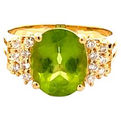 Item Specifications: Style: Statement ring Metal: 18k Yellow Gold Ring Weight: 4.90 grams Ring Size: 7 Ring Height: 10.86 mm Gemstone Specifications: Gemstone: Peridot Topaz Measurements: 10.82 mm x 8.84 mm x 5.56 Topaz Carat Weight: ~3.36 Carats Color: Lime Green Shape: Oval Transparency: Transparent Diamond Count: 14 diamonds Diamond Weight: 0.15 carats Diamond Color: H Diamond Clarity: SI2 Condition: Preowned, Excellent Stamped: "18K" "750" Please see all photos for details, feel free to ask all questions before bidding. 100% Authenticity Guaranteed 7 Ring, No Dudes, 18k Yellow Gold Ring, Ring Metal, Yellow Gold Ring, Diamond Clarity, Yellow Gold Rings, Metal Rings, Statement Ring