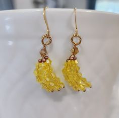 Yellow glass beaded banana bunch earrings. Super cute gift ideas for banana and fruit lovers🍌 I offer a variety of metal finishes of french hooks in case of sensitivity, but all of them are hypoallergenic and Nickle free! Check my FAQs for information on how to care for your metal jewelry.  Check out the pictures to see what each material style looks like.  French hook finishes available:  18k gold plated stainless steel  Gold plated brass  Silver plated brass  Rose gold plated brass  Sterling silver  I use high quality glass beads for all of my items. My main goal is to create beautiful peices that are also affordable!  Every item is made to order, If you like the style but prefer another color, I'm happy to customize it for you! Just message me what you're looking for, and we will come Nickel-free Yellow Beaded Earrings As Gift, Nickel-free Yellow Beaded Earrings For Gifts, Nickel Free Yellow Beaded Earrings For Gift, Yellow Dangle Beaded Earrings For Gifts, Yellow Beaded Earrings For Gift, Yellow Fruit Design Earrings For Gift, Yellow Fruit Design Earrings As Gift, Yellow Fruit Design Earrings Gift, Elegant Yellow Beaded Earrings For Gift