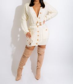 Slip into the Pretty In Pearls Sweater Mini Dress Ivory and experience the definition of sophisticated femininity. This stylish design is crafted from a sumptuous knit fabric and features long sleeves with a flirtatious V-neckline, pearl-embellished accents, and a waist-cinching belt for a flattering fit. Offering an elegant balance between day and night, this refined piece is perfect for both occasions. Pair with a mini bag fabulous thigh high boots or heels for a knock out look. Model wearing White Long Sleeve Sweater Dress For Winter, Elegant Cream Sweater For Fall, Cream Knit Long Sleeve Sweater Dress, Cream Long Sleeve Knit Sweater Dress, Long Sleeve Cream Knit Sweater Dress, Cream Fitted V-neck Sweater Dress, White Long Sleeve Sweater Dress For Fall, Winter White Long Sleeve Sweater Dress, Chic Cream Mini Dress For Winter