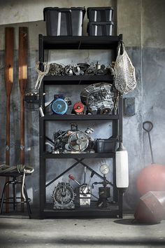 a garage filled with lots of different types of tools and equipment on top of shelves