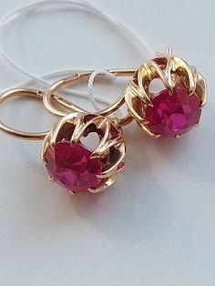 Vintage 14K Beautiful Water Lily Earrings Ruby Corundum USSR 583 Rose Gold Soviet Retro Russian Women's jewelry, Vintage gift for woman and girlBase Metal: Gold 14K (Russian Hallmark: 583 Star with Sickle and Hammer)Base Stone: Ruby LAB (synthetic)Manufacturer Country: USSR Soviet Union RussiaTotal weight: 4.33 g.Enjoy your shopping! Ruby Earrings With Prong Setting, Gold Earrings With Prong Setting In 14k Rose Gold, Rose Gold Ruby Earrings For Gifts, Pink Oval Ruby Earrings, Pink Ruby Earrings For Anniversary, Rose Gold Ruby Round Earrings, Formal Pink Gold Gemstone Earrings, Elegant Ruby Jewelry In Pink Gold, Rose Gold Gemstone Earrings For Evening